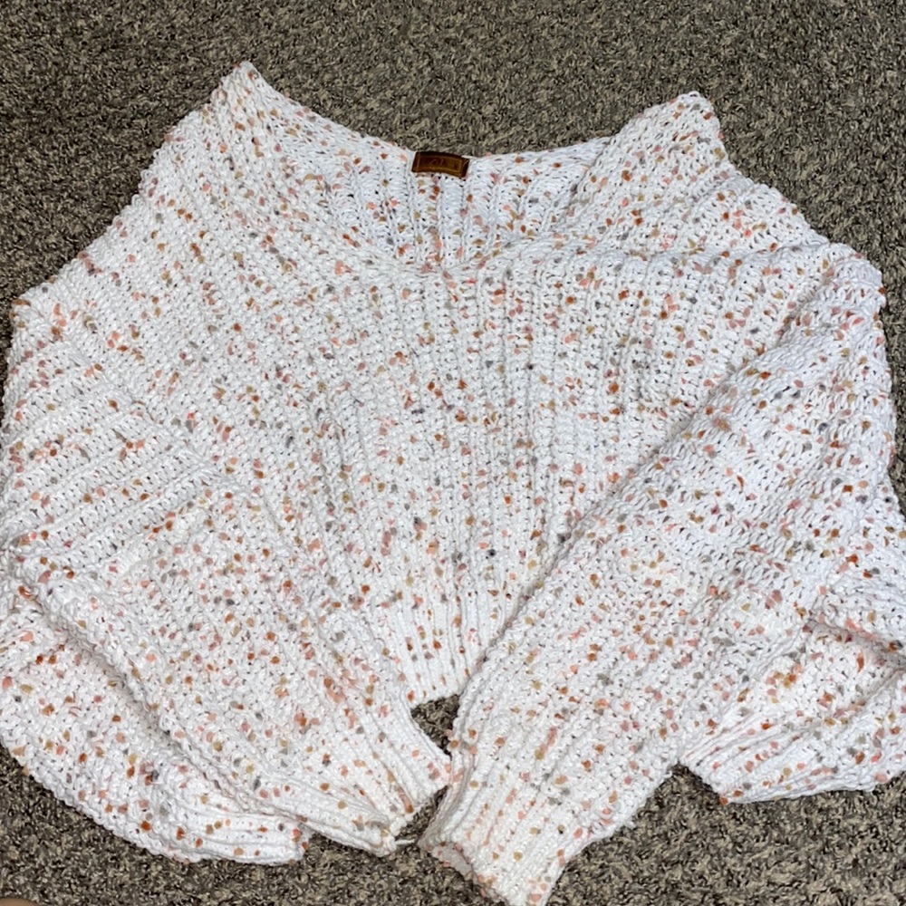 cute knitted sweater, length is shorter but not cropped